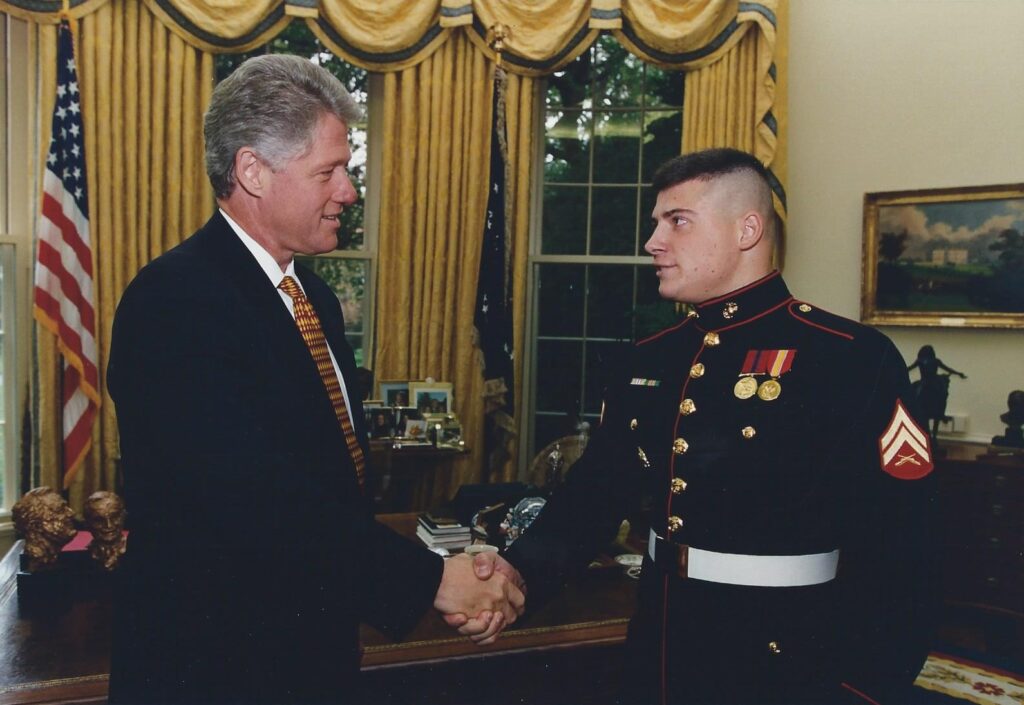 Janae Marie Kroc during her time as a Marine with President Clinton